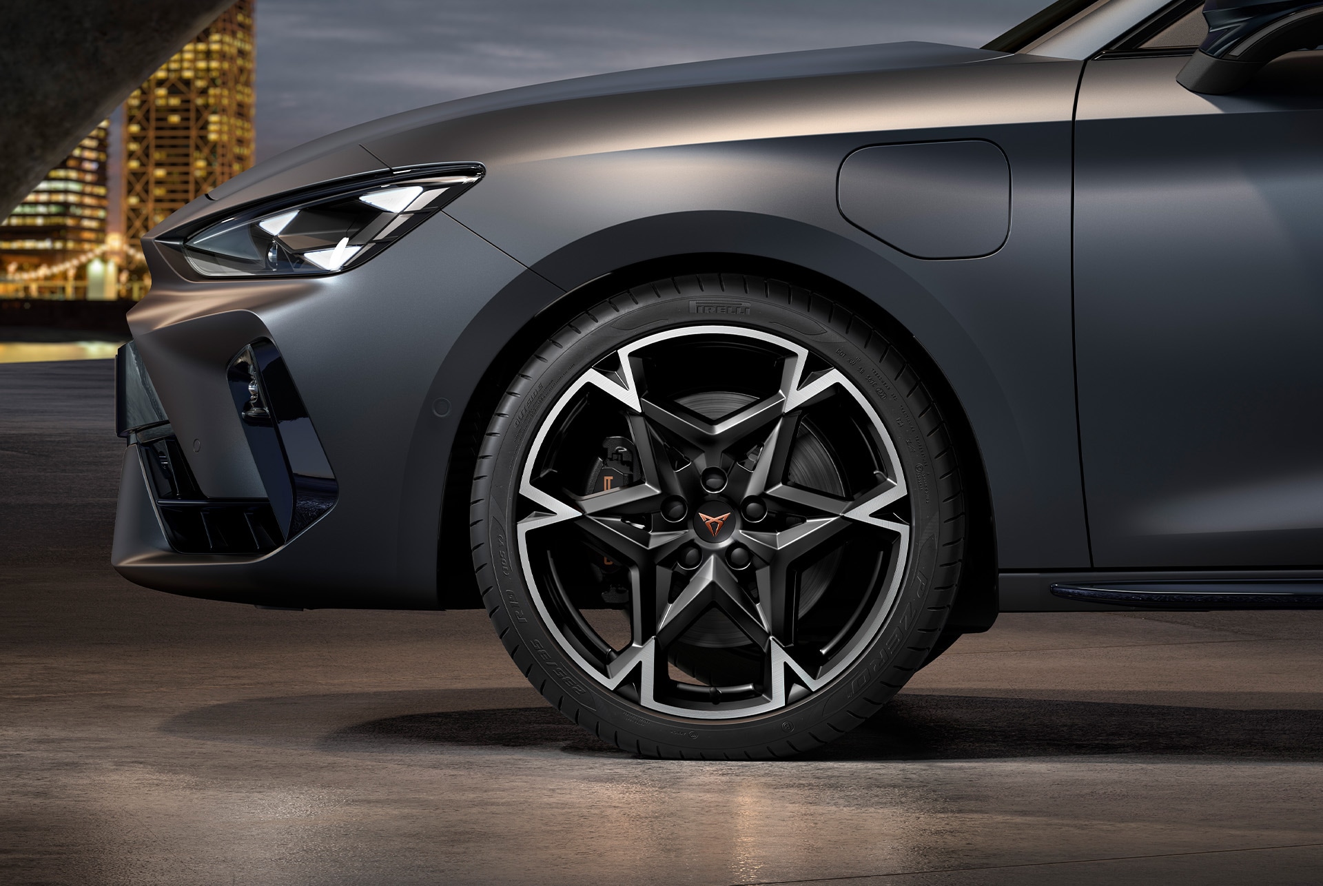 front side view of left machined polar alloy wheel in black and silver for the new cupra leon spotstourer 2025, tyres, signature headlights and grey body