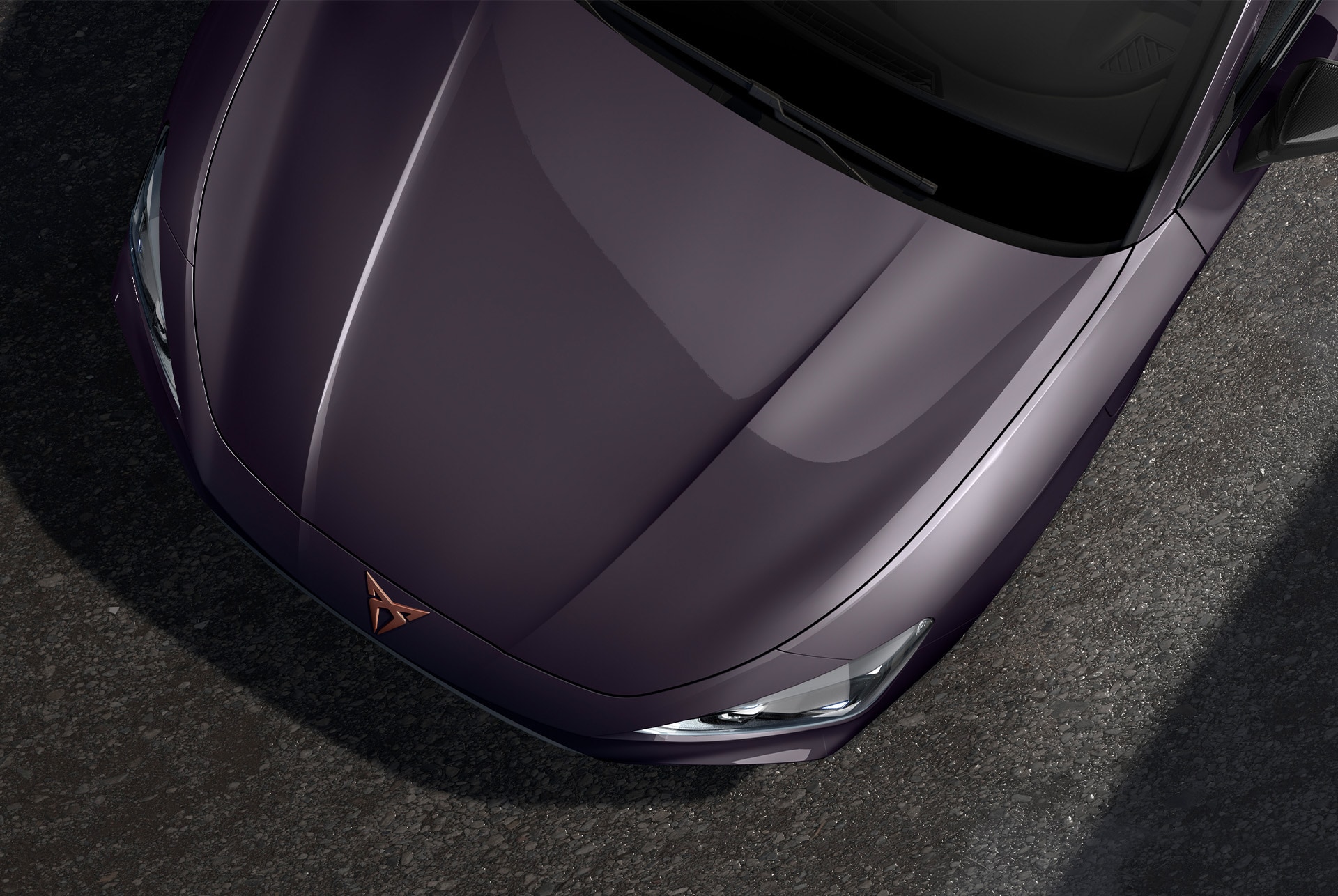 bird’s eye view of a dark void special metallic Cupra Leon 2025 car hood.