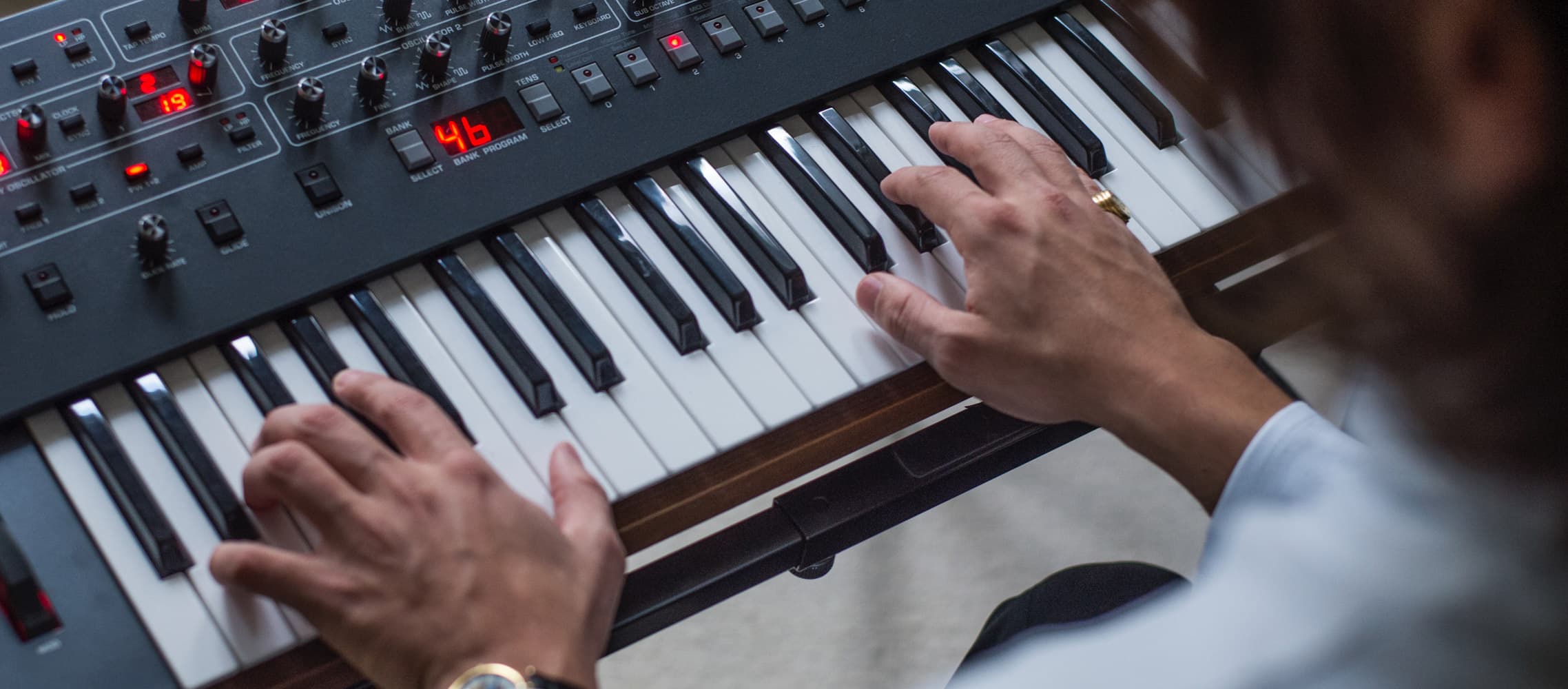 DJ Argy playing the piano and the synthetizer