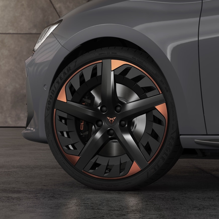 new CUPRA Leon five doors ehybrid Compact Sports Car with 19” Machined Alloy wheels in Black and Copper. Close view.