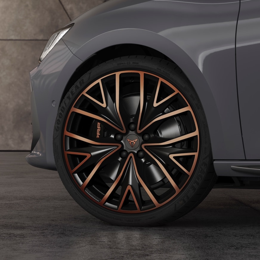 new CUPRA Leon five doors ehybrid Compact Sports Car with 19” Performance Alloy wheels in black satin and Copper. Close view.