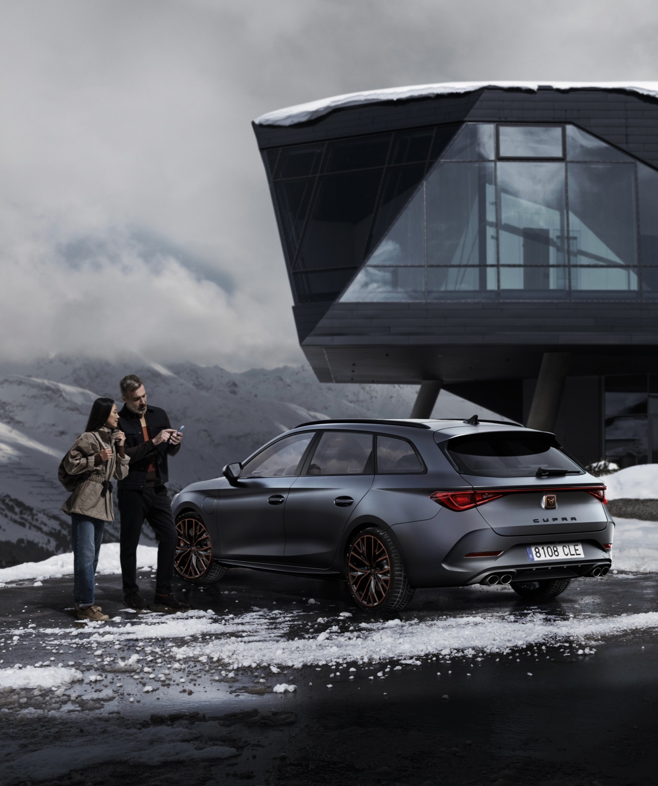 couple-next-to-their-cupra-leon-with-matte-paint