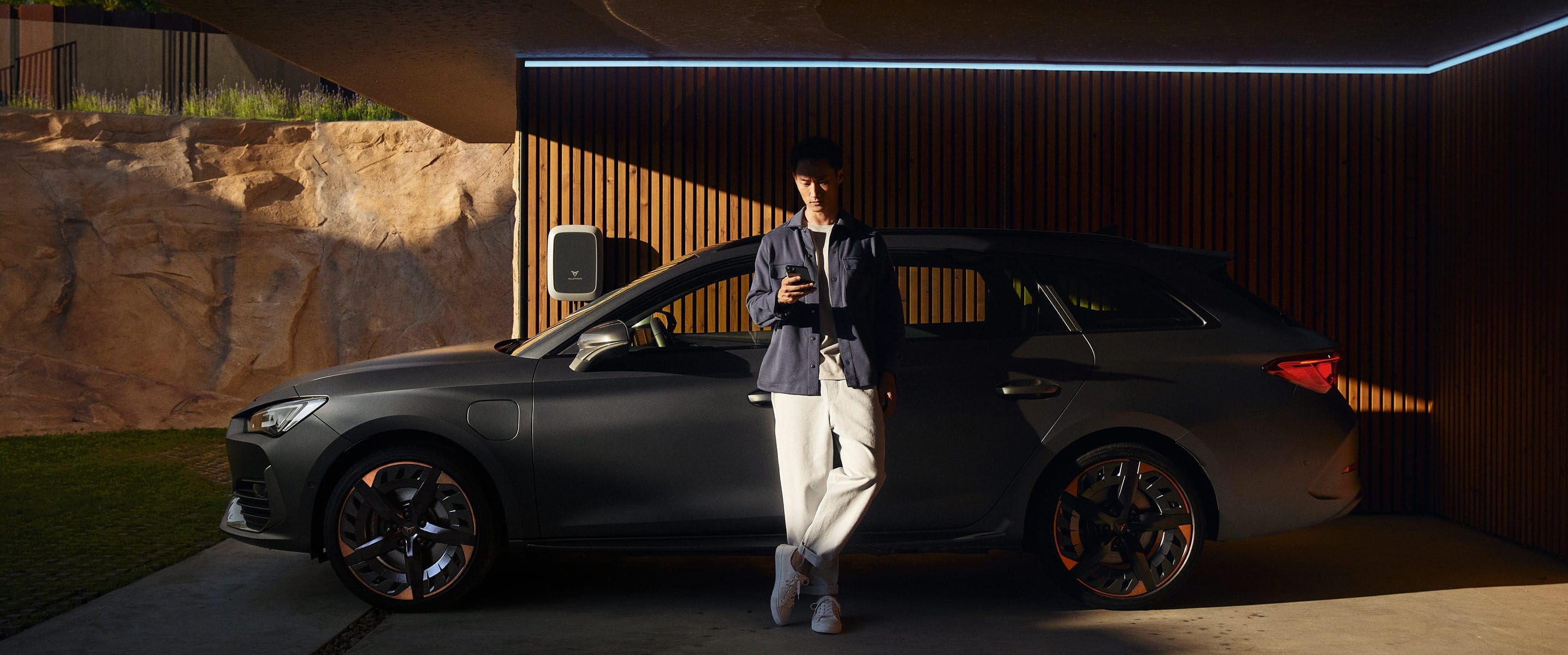 man-in-front-of-cupra-leon-sp-magnetic-tech-matt-grey 